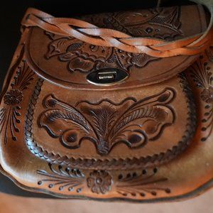 Genuine leather hand etched flower bag.